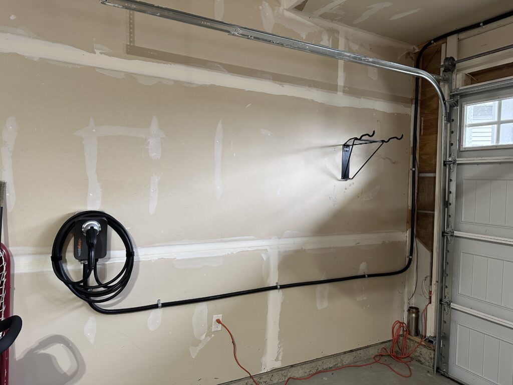 Professional Level 2 EV charger installation by Oakwest Electric featuring a dedicated 240V circuit.